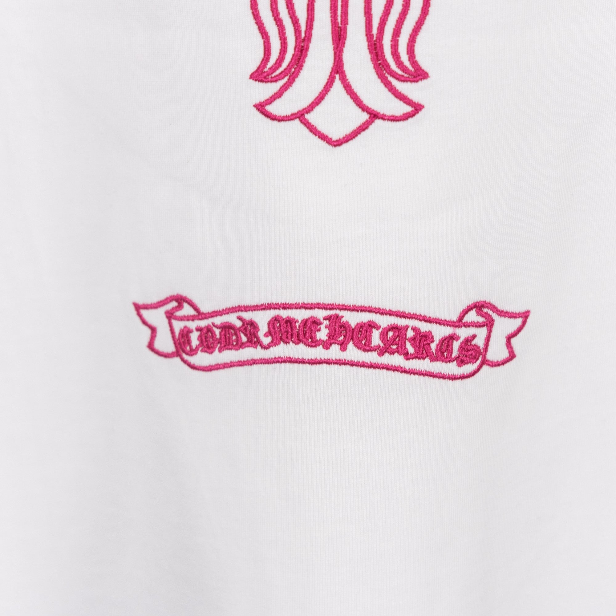 White T-shirt embroidery banner with pink lettering and striped motifs