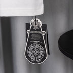 White T-shirt sleeve hem with hanging black-and-white hang tag