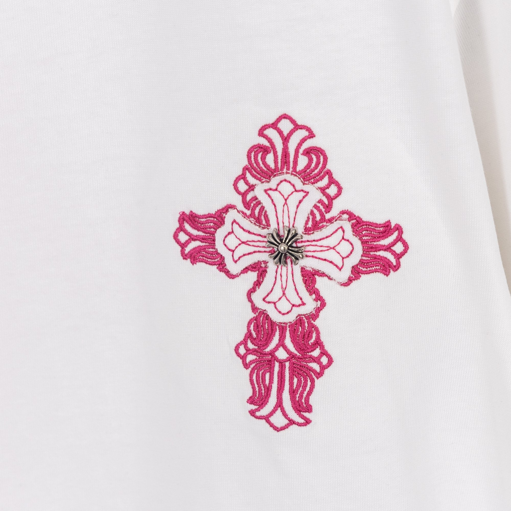 White T-shirt with detailed pink embroidered cross with small central bead