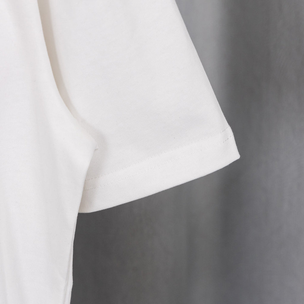 White T-shirt with curved hem and short sleeve cuff