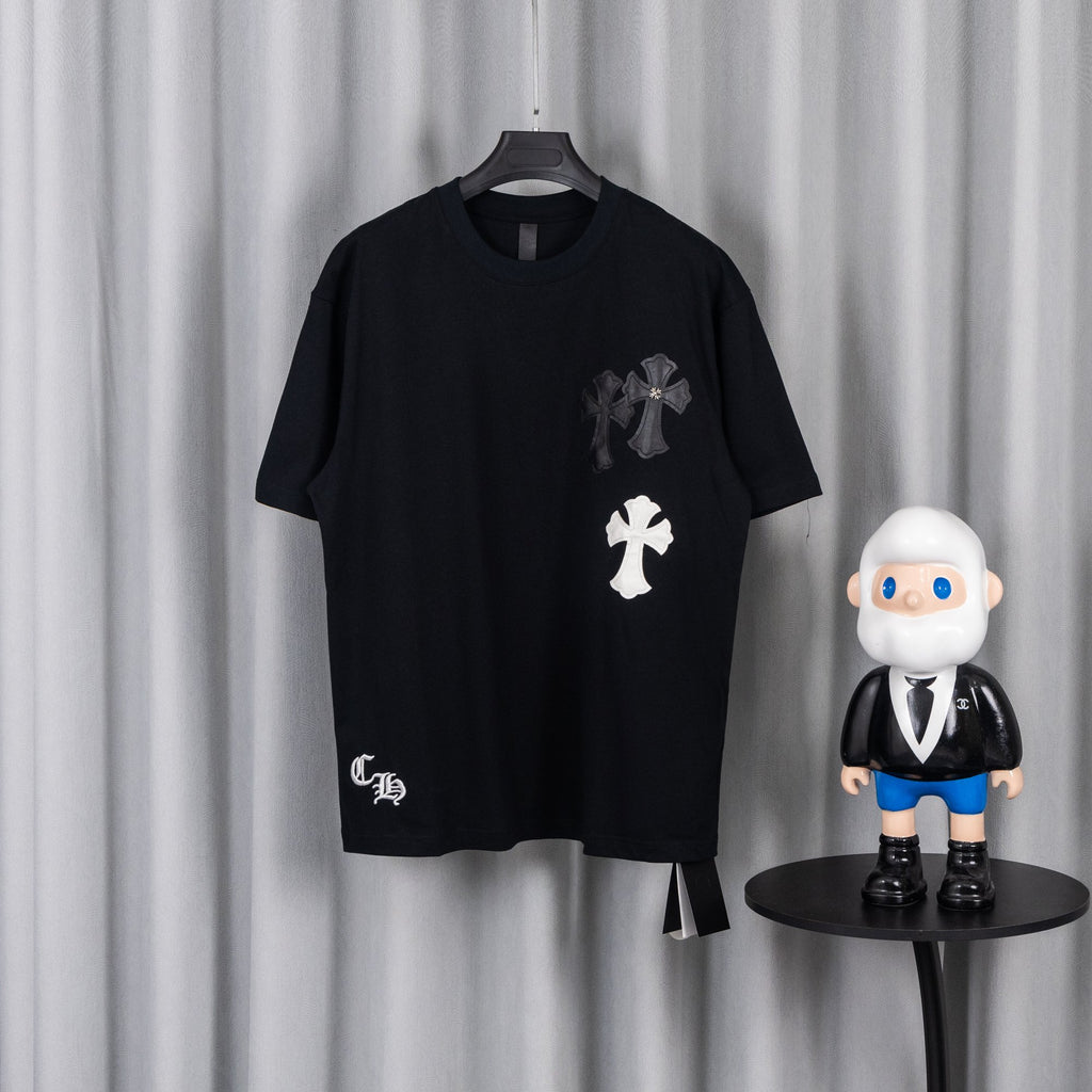 Black short-sleeve T-shirt with white and gray cross chest appliques.