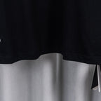Black short-sleeve T-shirt hem with clean curved bottom edge.