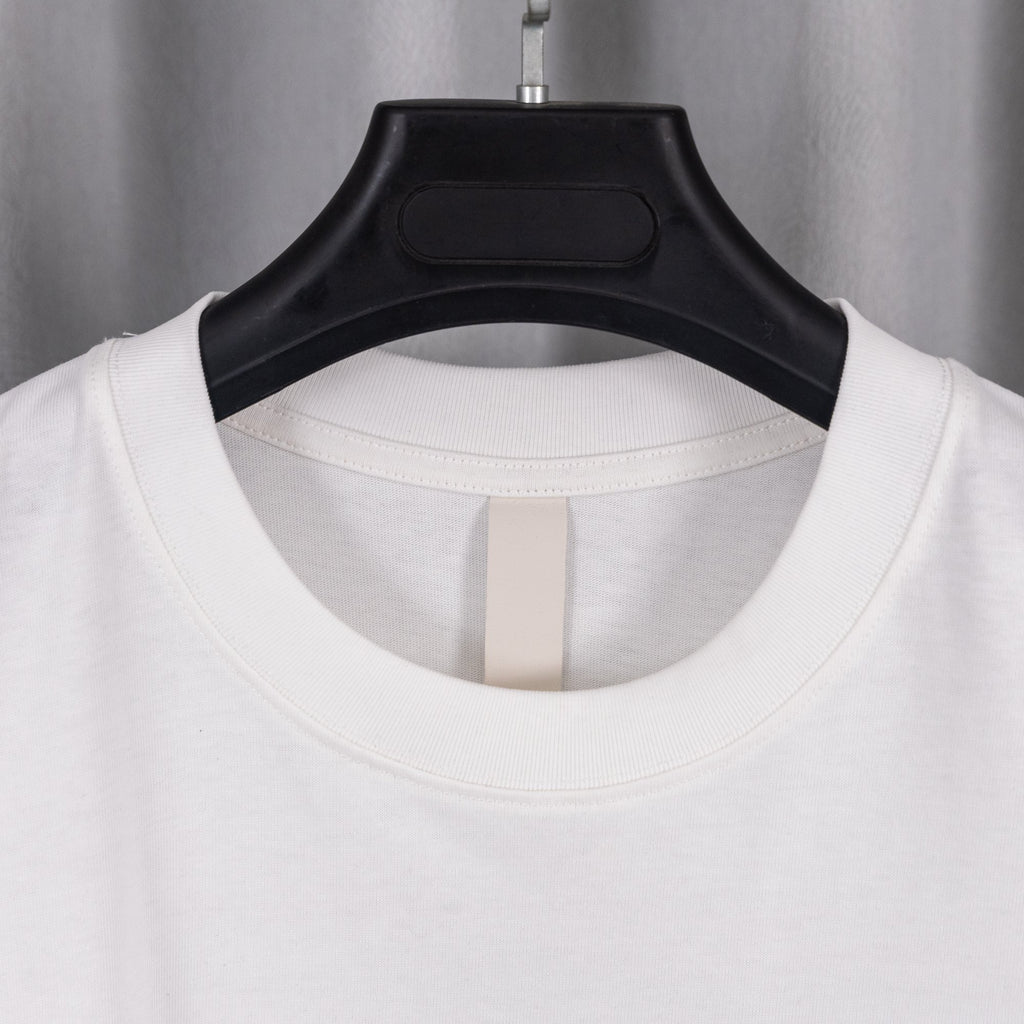 White crewneck T-shirt with ribbed collar opening on black hanger