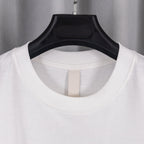 White crewneck T-shirt with ribbed collar opening on black hanger