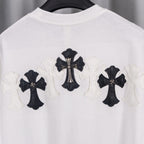 White T-shirt back with central black cross applique and three cross motifs