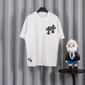White short-sleeve T-shirt with black cross appliques on chest and sleeves