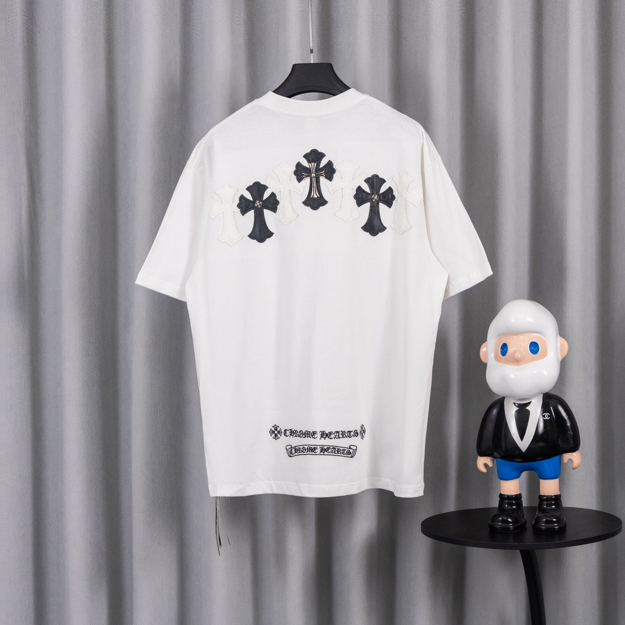 White short-sleeve T-shirt with three black cross appliques on back