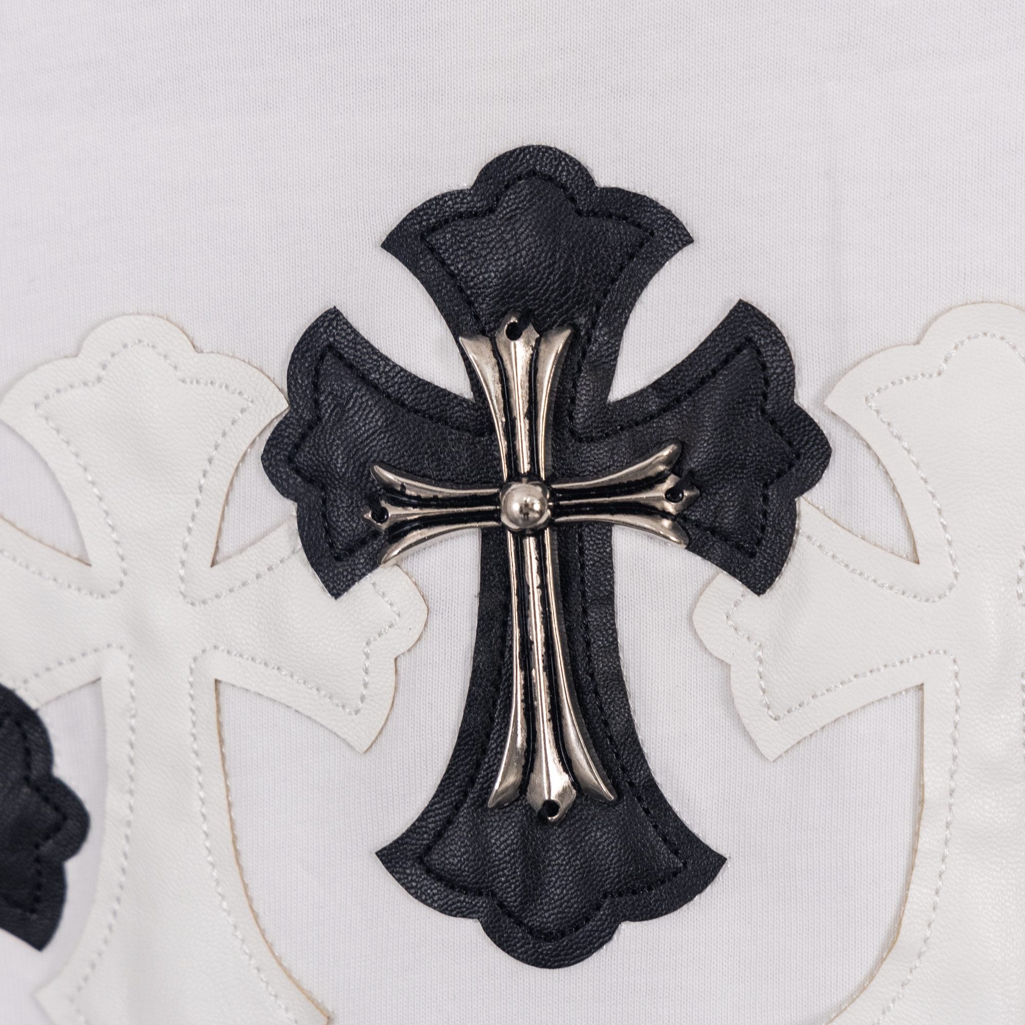 White short-sleeve shirt with black cross graphic applique