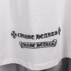 White short-sleeve shirt with 'Chrome Hearts' style logo text