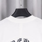 White T-shirt neckline and upper back with dark graphic emblem