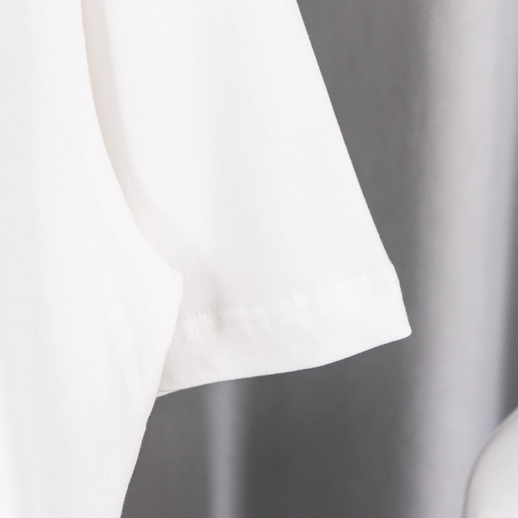 White short-sleeve T-shirt cuff with seam detail