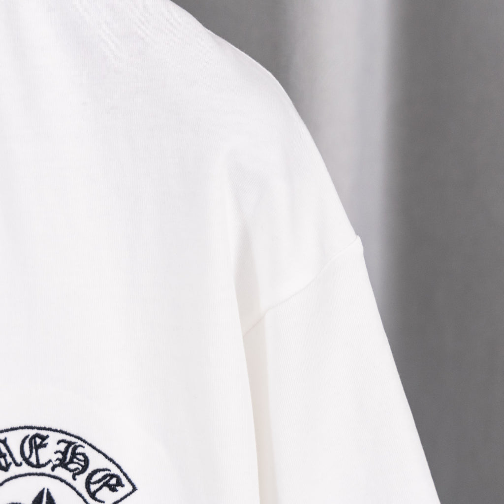 White short-sleeve T-shirt with partial chest logo patch