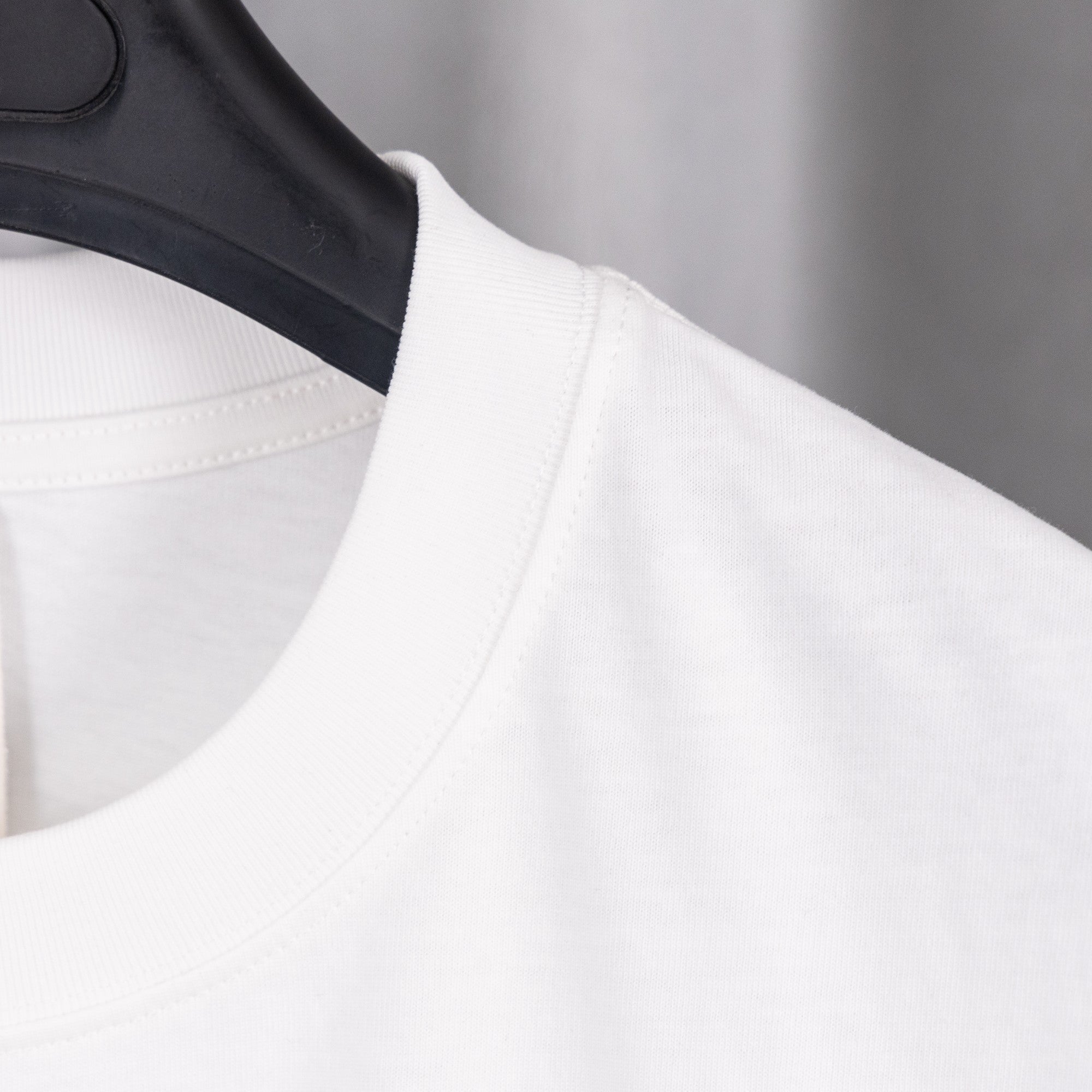 White short-sleeve T-shirt neckline and shoulder seam