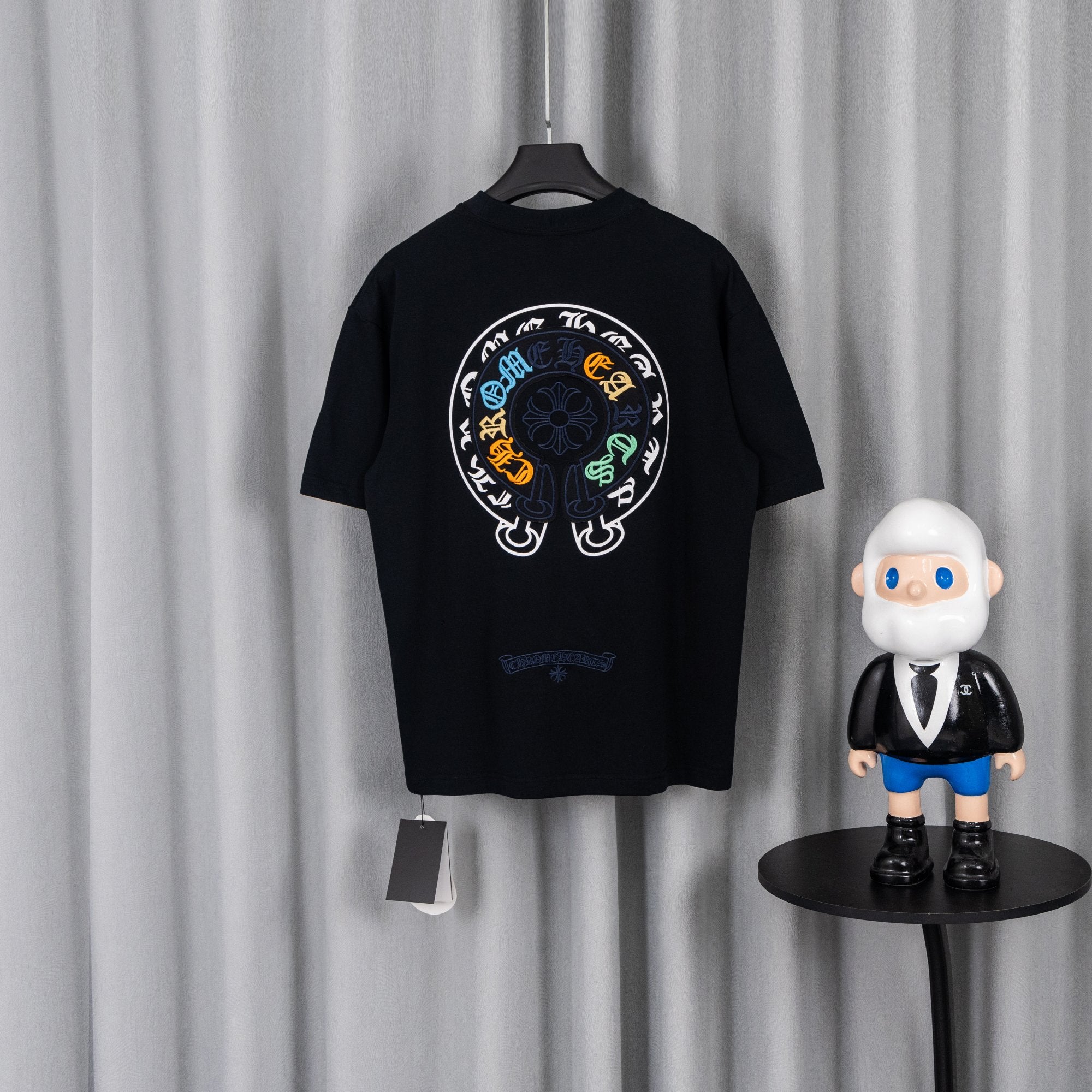 Black crewneck short-sleeve T-shirt with large circular back graphic print