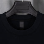 Black crewneck T-shirt neckline with black inner brand label