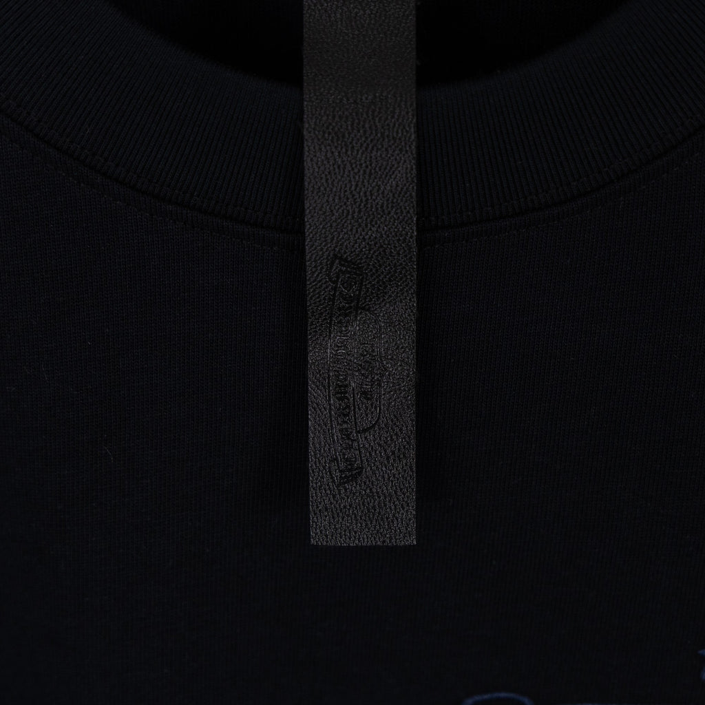 Black T-shirt collar with stitched inner label