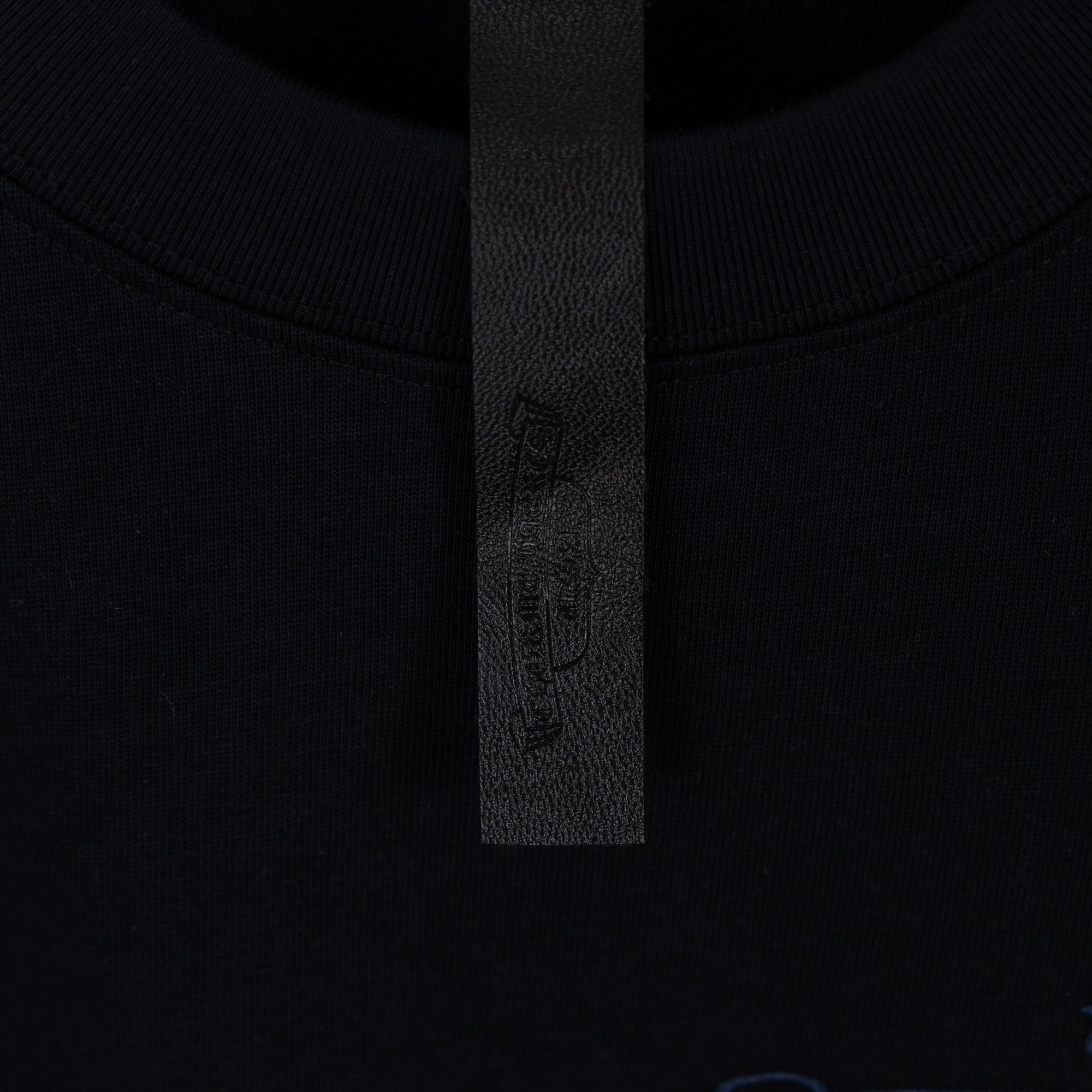 Black T-shirt collar with stitched inner label
