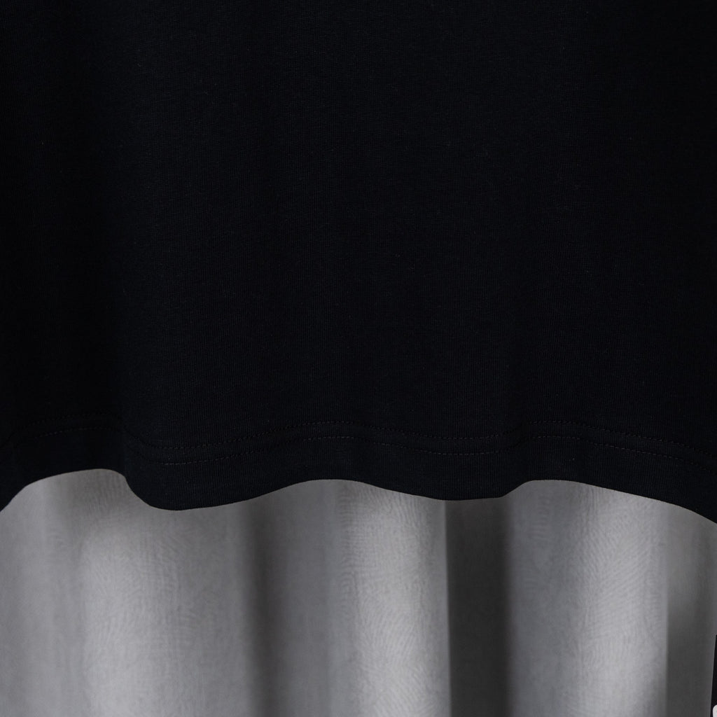 Black T-shirt hem with clean stitched edge