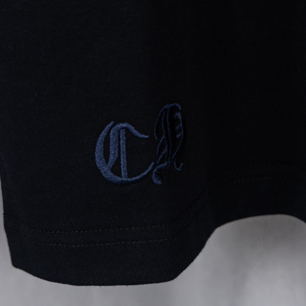 Black T-shirt sleeve cuff with blue embroidered logo