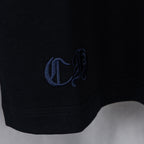Black T-shirt sleeve cuff with blue embroidered logo