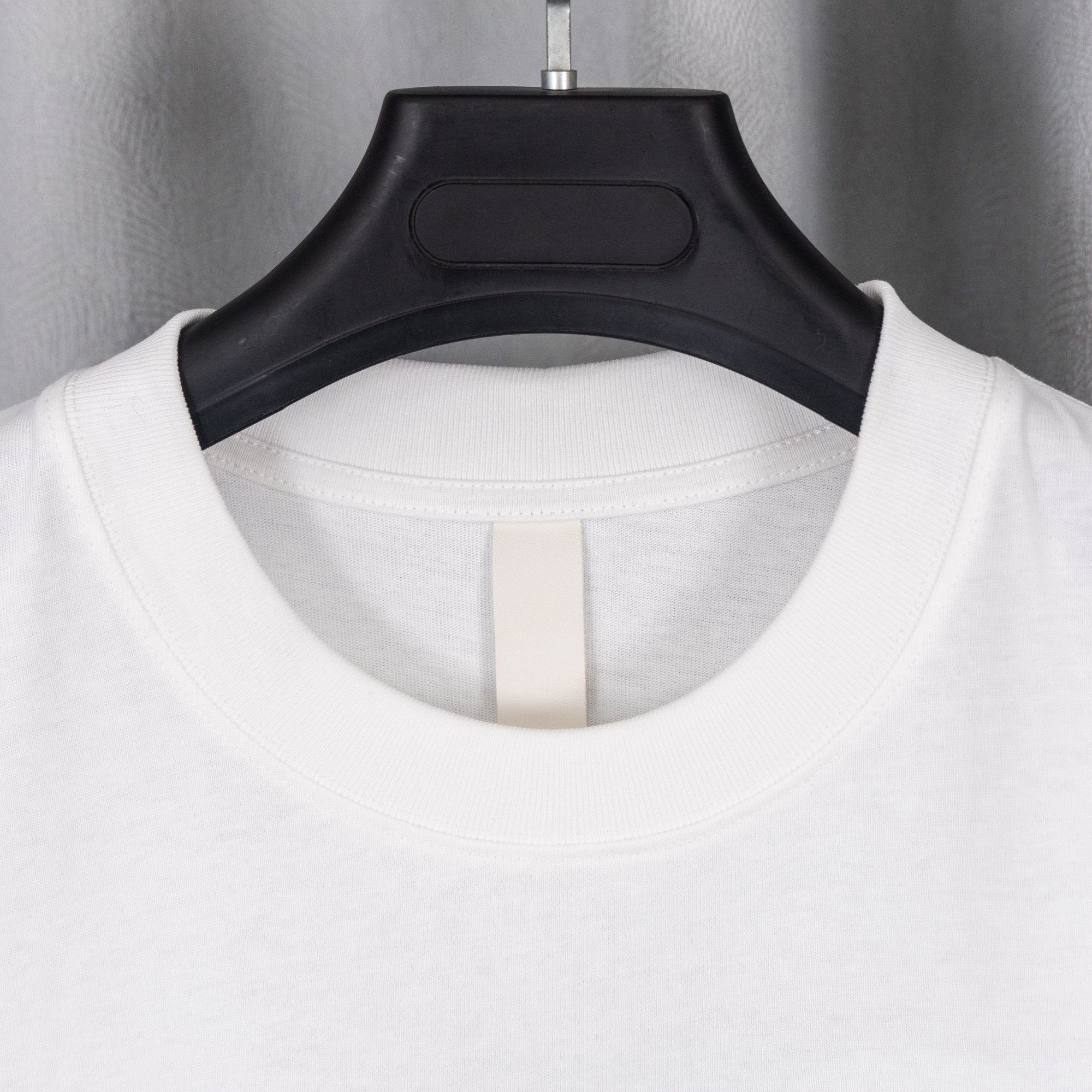 White T-shirt back neckline with ribbed collar and keyhole cutout seam