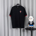 Black short-sleeve T-shirt with red trim cuffs and small chest graphic patch