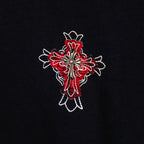 Black T-shirt with red and white flower cross embroidery on the front