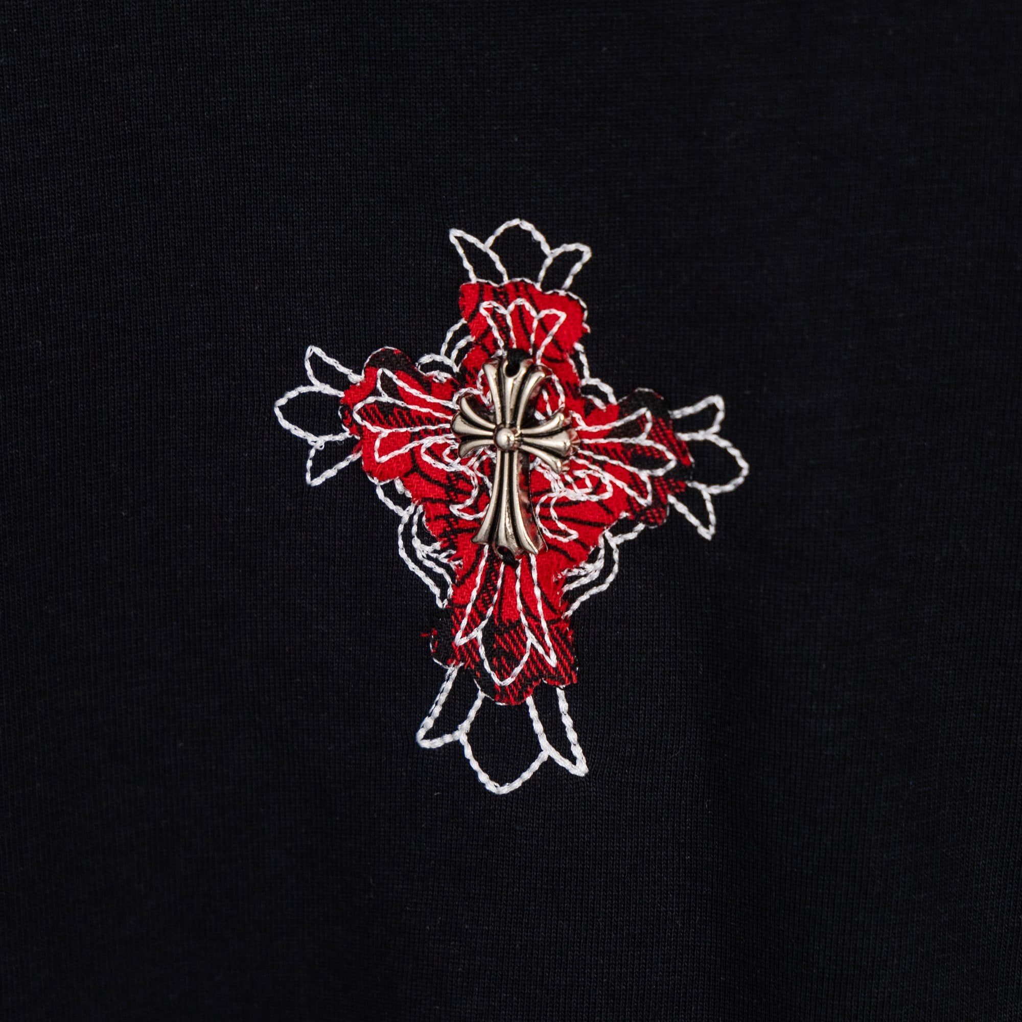 Black T-shirt with red and white flower cross embroidery on the front