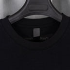 Black T-shirt collar and inner neck label view under hanger