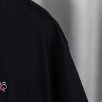 Black short-sleeve T-shirt with small embroidered emblem and sleeve