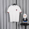 White crew-neck short-sleeve T-shirt with red plaid graphic on chest and sleeve trim
