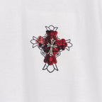 White T-shirt with small red plaid cross graphic with flower and ribbon details