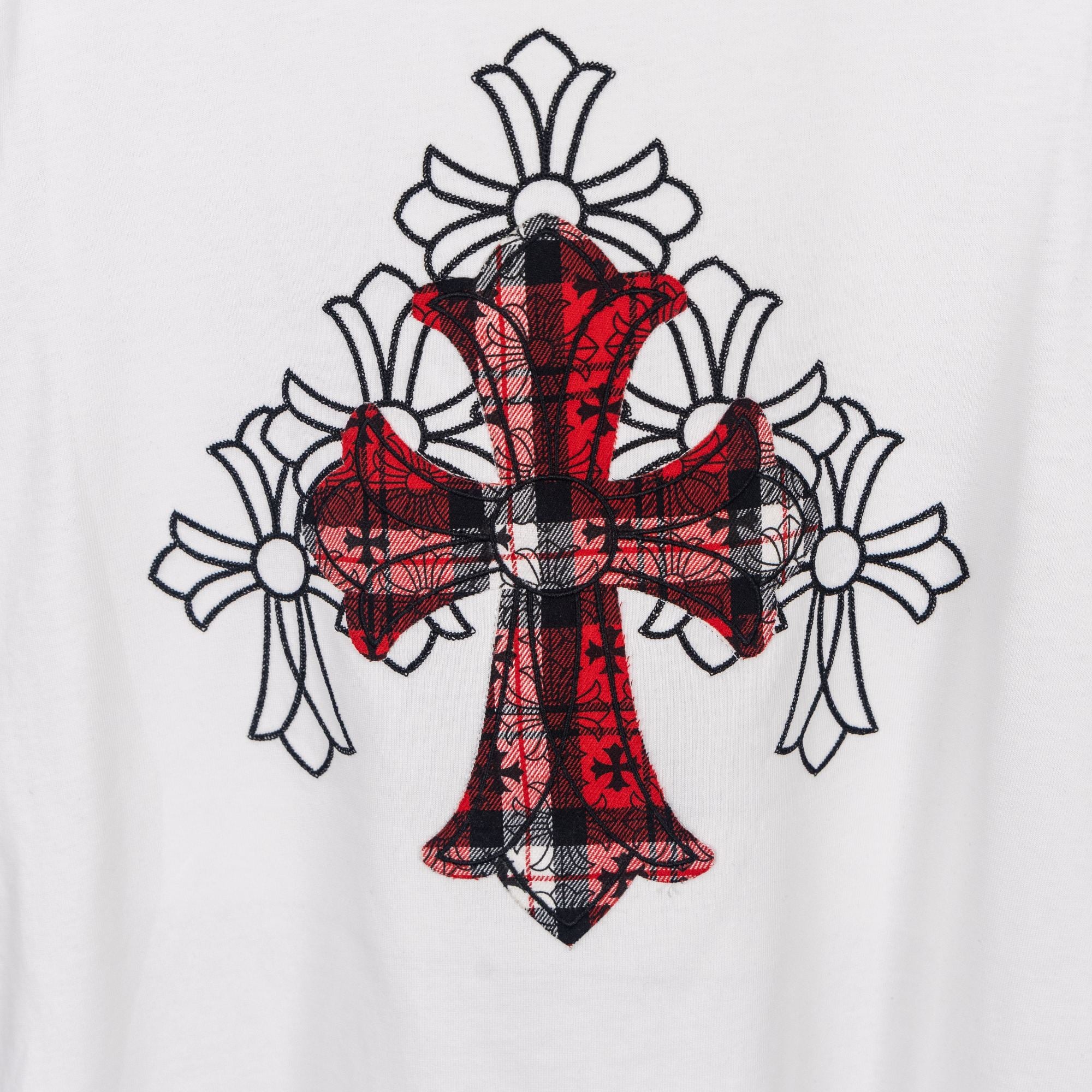 White T-shirt with large red plaid cross graphic with floral accents