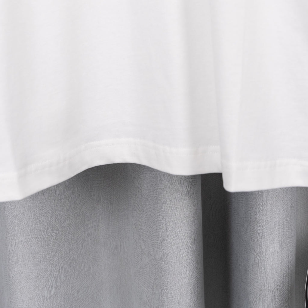 White short-sleeve T-shirt hem with subtle drape folds