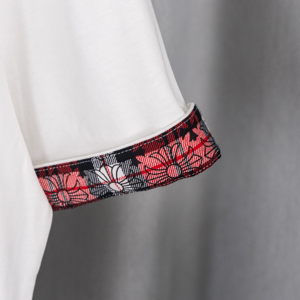 White T-shirt sleeve with red black plaid cuff trim