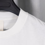 White T-shirt crew neck seam and curved graphic placement at upper chest