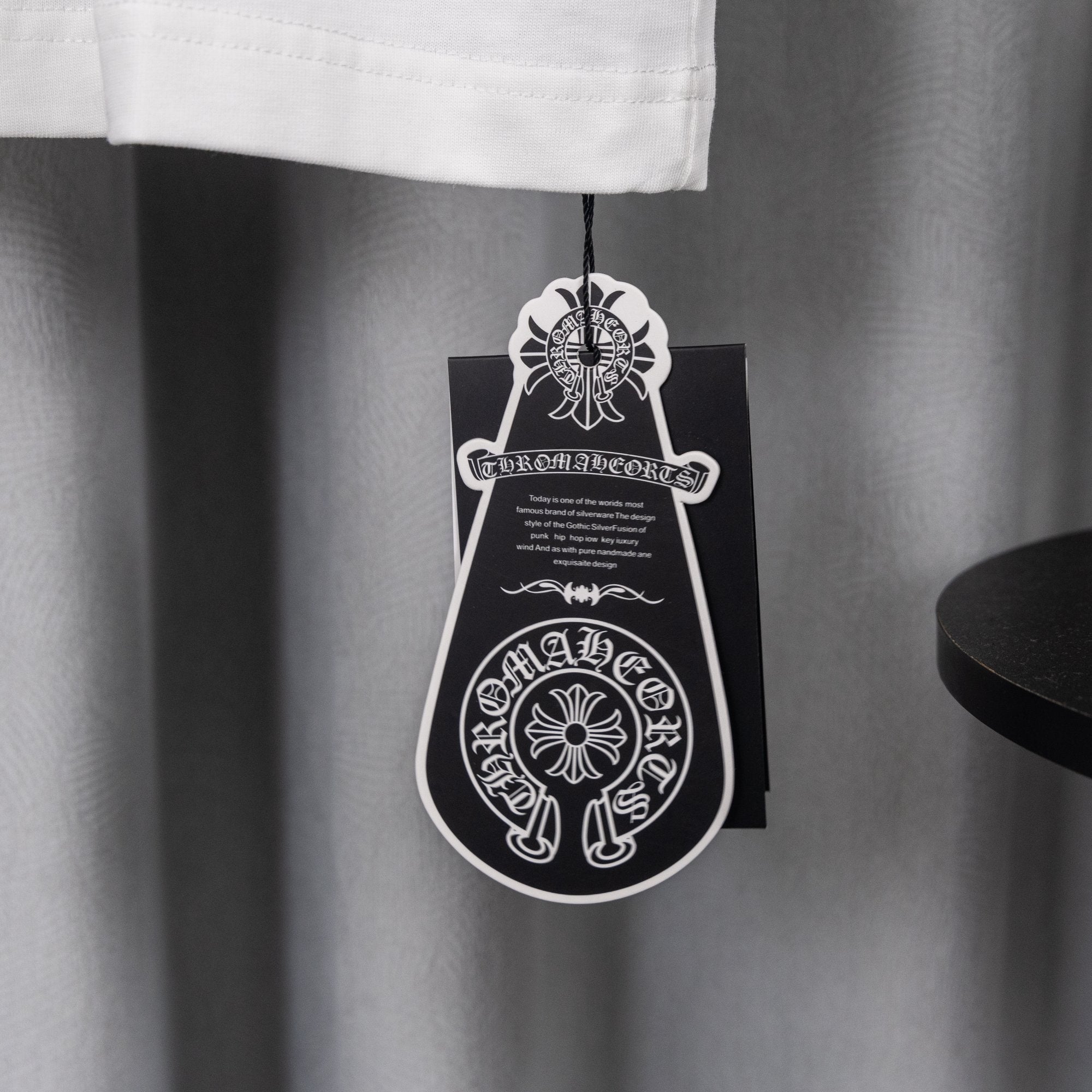 White shorts with black hanging apparel tag
