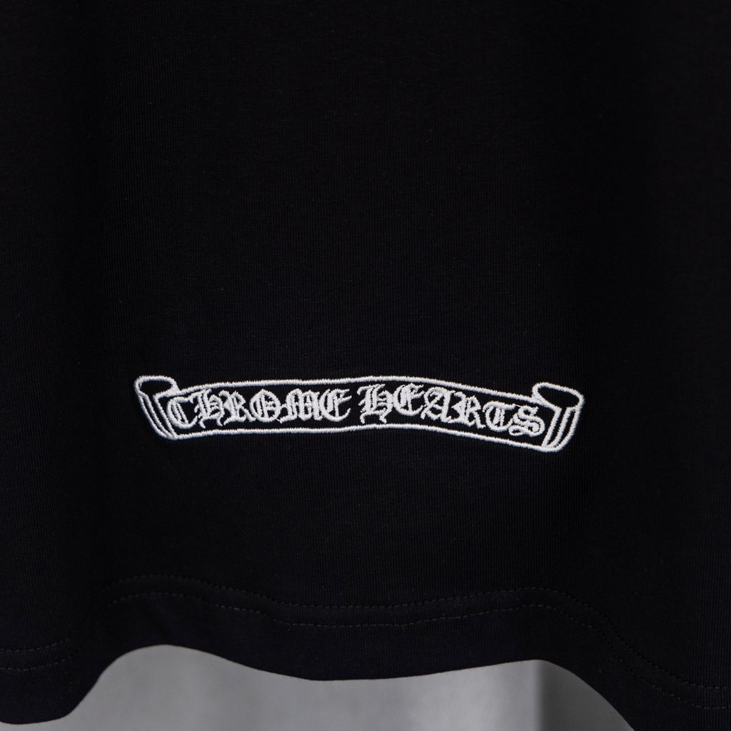 Black T-shirt with white rectangular text logo at lower chest.