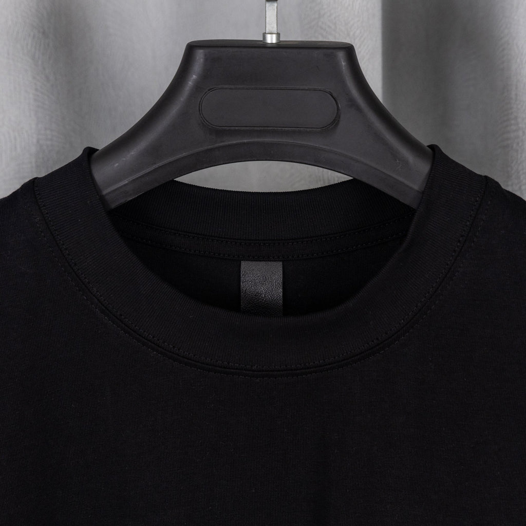 Black crewneck T-shirt with ribbed collar and short sleeves