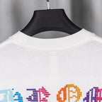 White crewneck T-shirt back view with colorful pixel-style graphic near hem