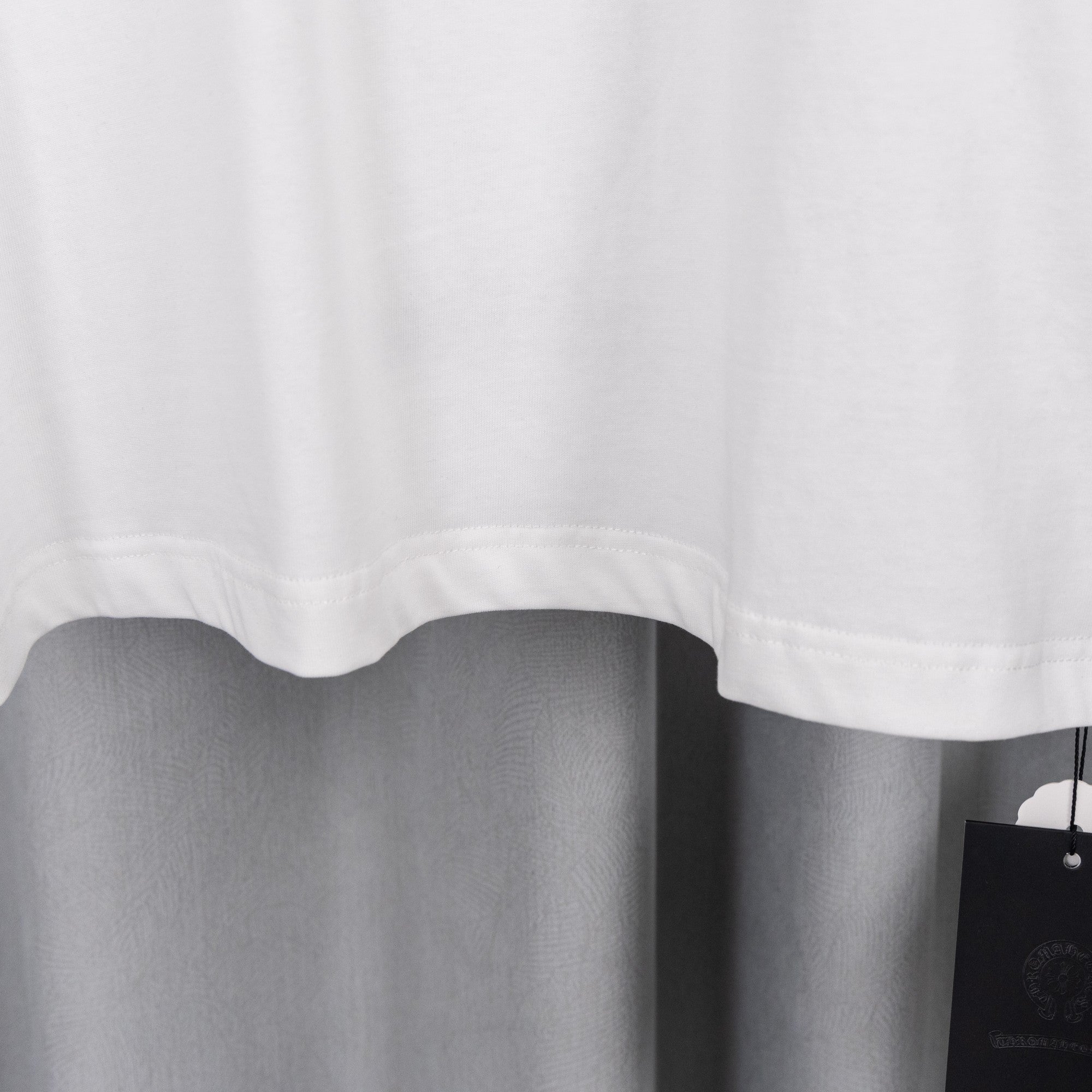 White T-shirt hem with side vent and clean fabric finish