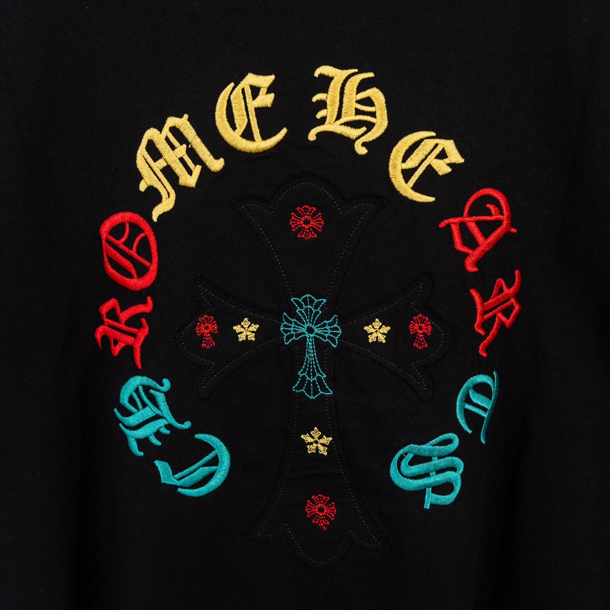 Black T-shirt with embroidered-style multicolor circular cross graphic