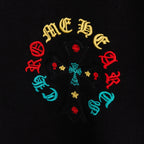 Black T-shirt close-up of multicolor circular cross graphic with small details
