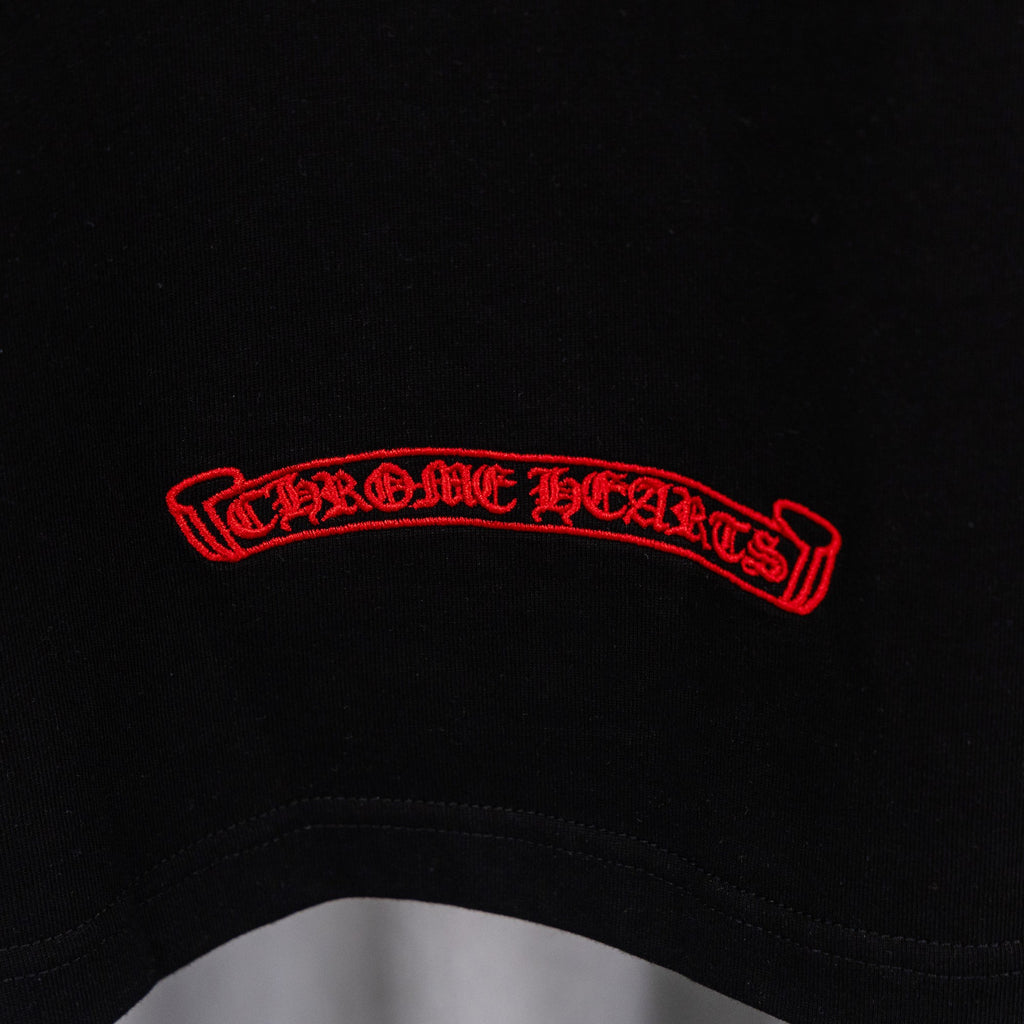Black T-shirt with red curved text logo across chest