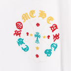 White T-shirt circular multicolor graphic with a central cross and colored accents.