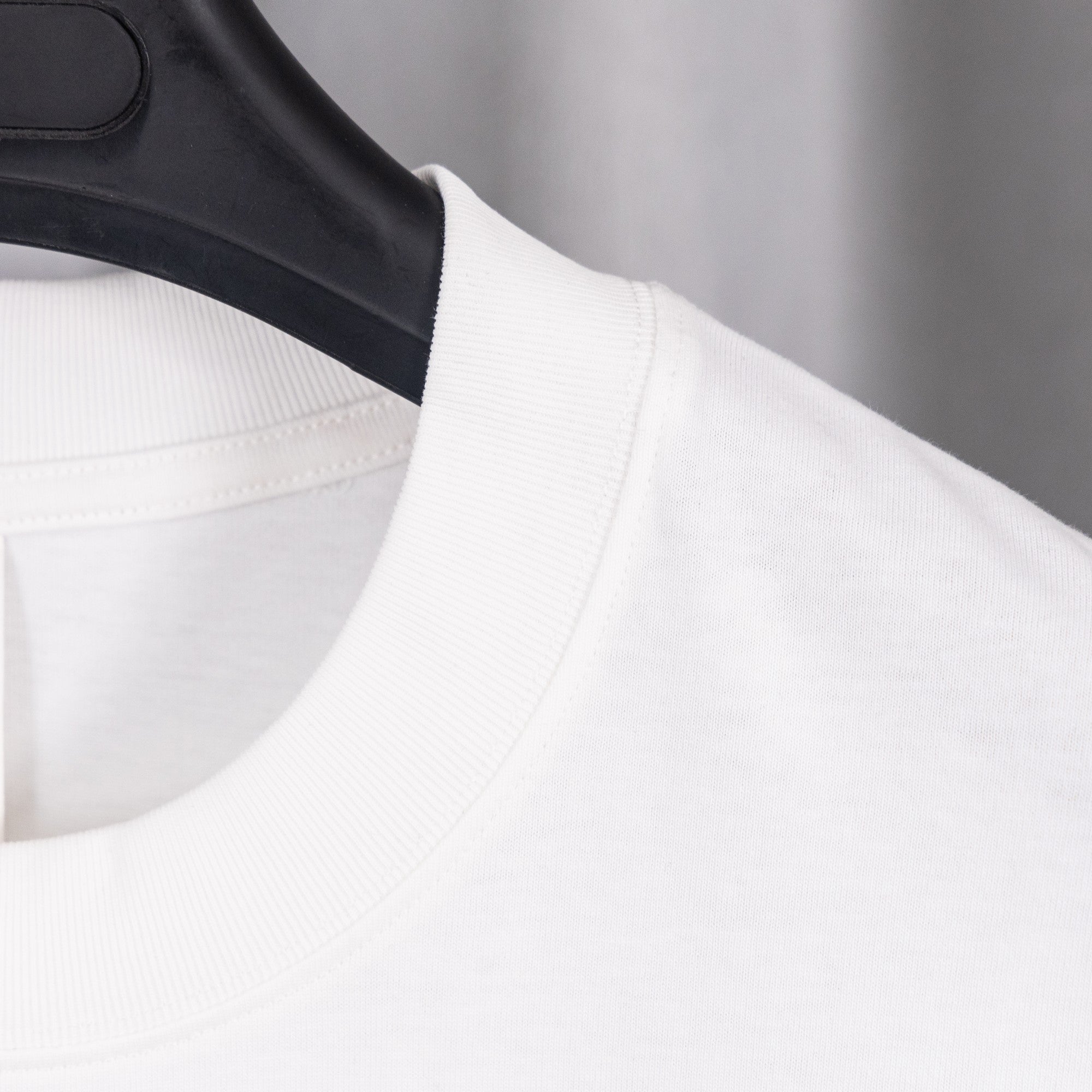 White crewneck T-shirt with ribbed neckline and short sleeves