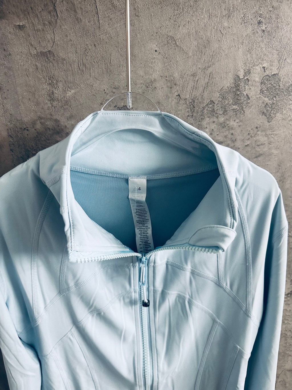 Ralph Lauren light blue zip-up jacket interior view of stand collar and zipper