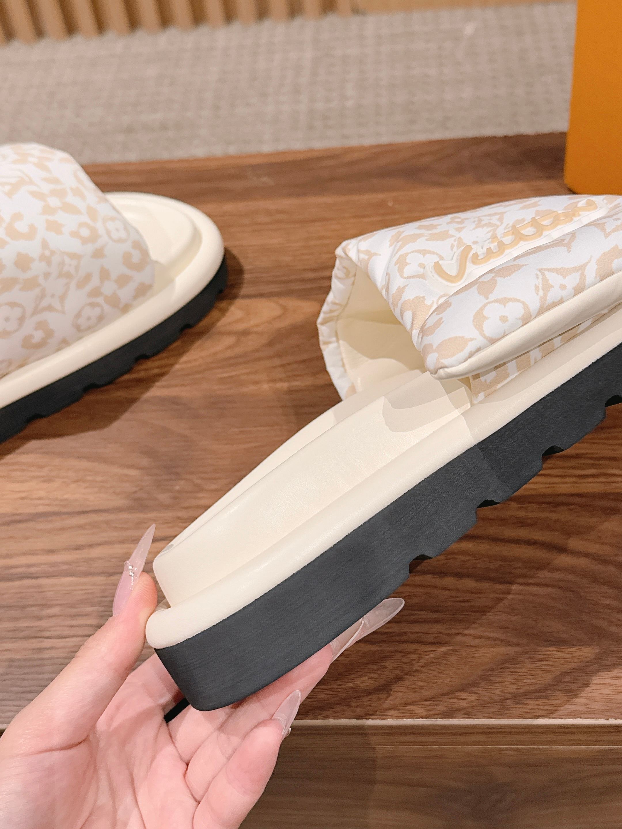 Louis Vuitton slide sandals, white upper with wraparound strap and chunky dark sole