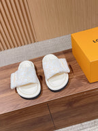 Louis Vuitton slide sandals in white with light-gold monogram pattern straps