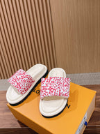 Louis Vuitton slide sandals, red monogram floral upper over white footbed, gray platform sole
